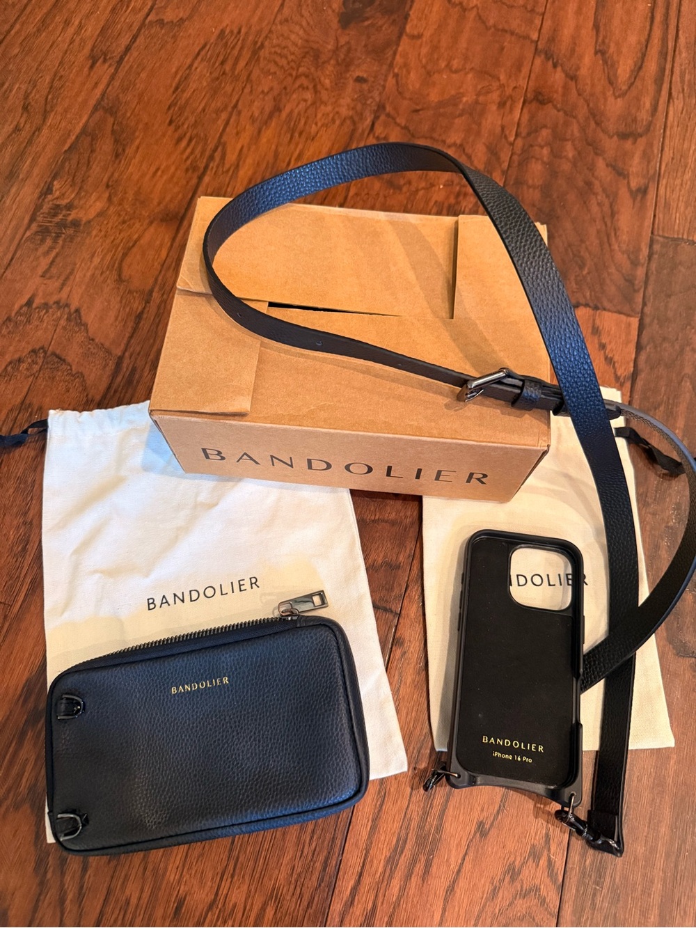 Bandolier Black Leather Crossbody iPhone case with Matching Zip Pouch & Strap.
